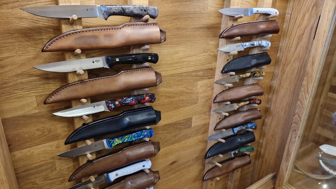 Emberleaf knives racked on the showroom wall