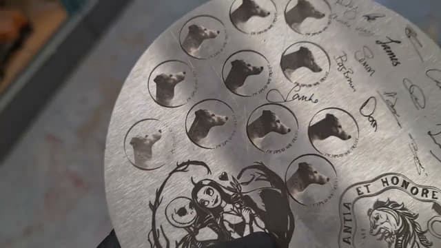A steel plate laser-engraved with portraits and lettering