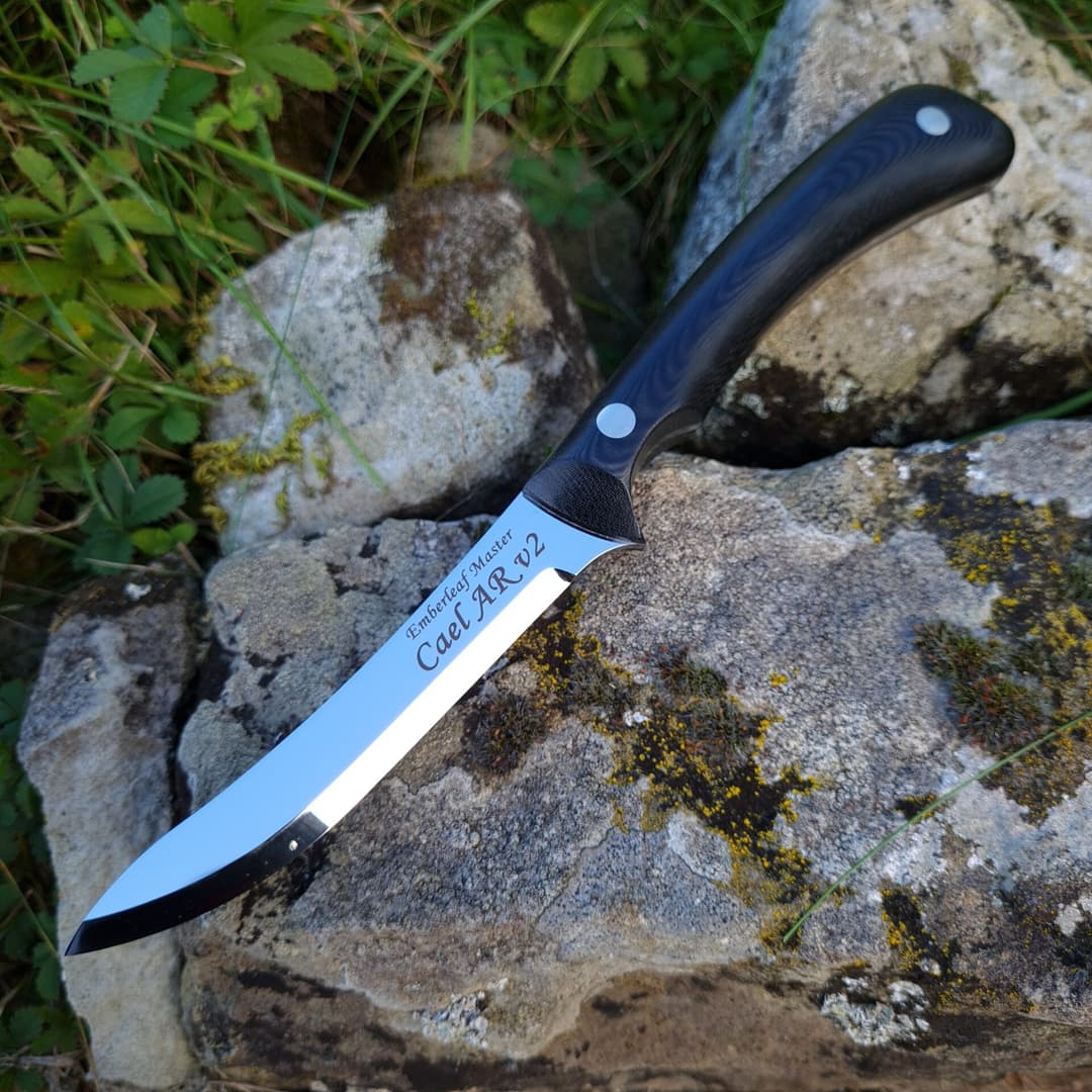 The Cael AR v2 master, its blade engraved Emberleaf Master
