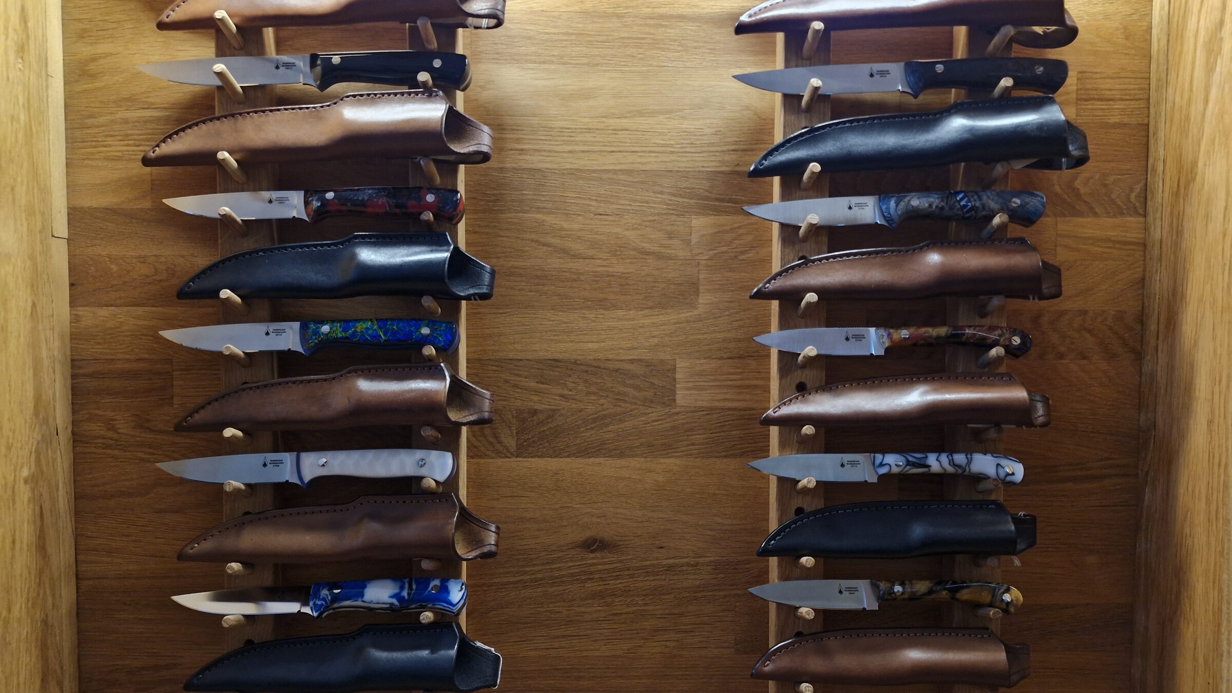 Close view of the central showroom rack, knives on oak pegs