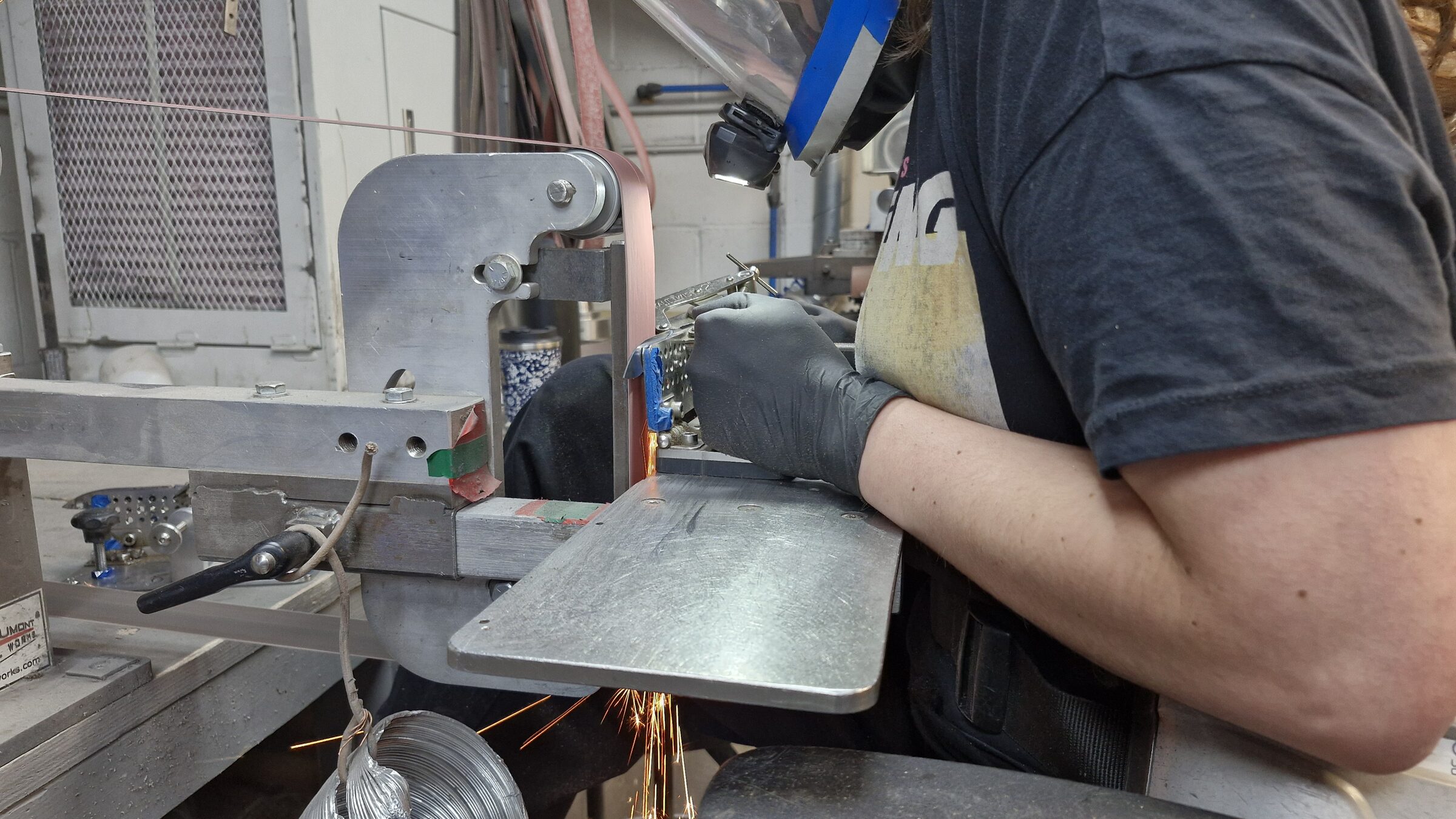 Spark shower off the belt as a bevel is ground
